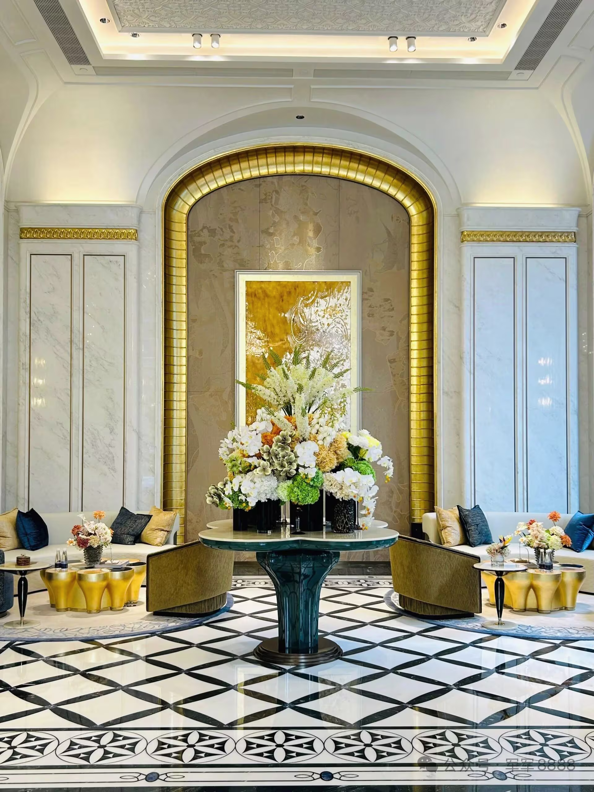 A considered marble interior with layered veining and warm natural light